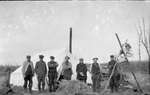 A group of hunters standing in front of a tent