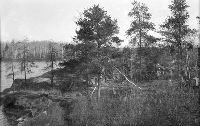 A log cabin by a lake