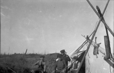 Four hunters at their camp