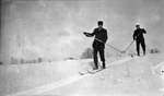 Two men cross country skiing