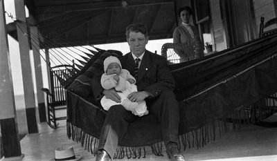 A young couple and baby at Griffis' summer home