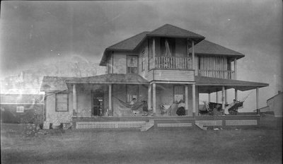 Women relaxing on the porch at Griffis' summer house