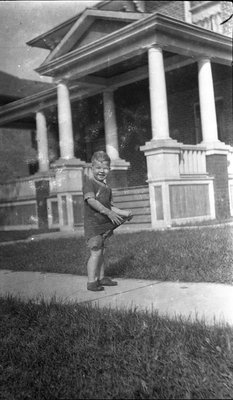 A young boy playing outside