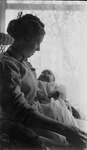 Griffis family photo of mother and child in front of a window