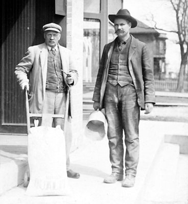 Two men standing on the ?King Street, Colborne