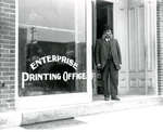 Photograph of Henry Gale standing outside the Enterprise Printing Office, Colborne, Cramahe Township