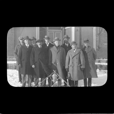 Curling Club posing with trophy