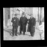 Three men standing in front of a jewellery store, King Street, Colborne
