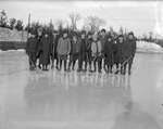 A group of young hockey players at an outdoor rink