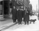 Three men standing in front of a jewellery store, King Street, Colborne