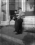 Two men standing in front of the Post Office, Colborne