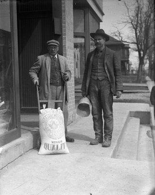 Two men standing on the ?King Street, Colborne