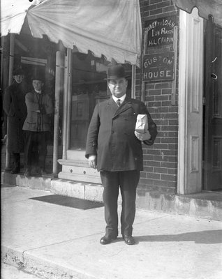 An unidentified man in front of Custom House, Colborne