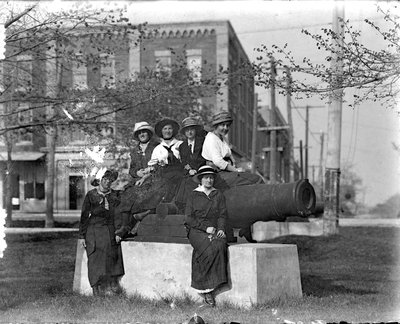 Six unidentified women pose with the cannon, Victoria Park, Colborne