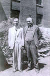 William R. Baxter and an unidentified man standing in front of Colborne High School