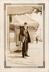 Man standing on King Street sidewalk, Colborne, Cramahe Township