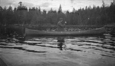 Man paddling a canoe