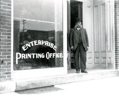 Henry Gale standing outside the Enterprise Printing Office, Colborne