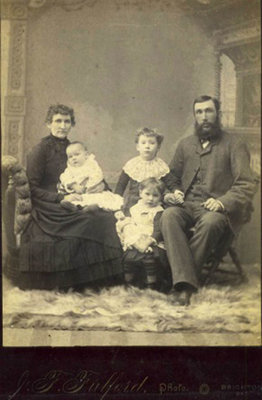 Studio portrait of William Mutton, Martha Elizabeth (nee Hubbs) Mutton,  Flora G., Myrtle C. and Ethel H. Mutton