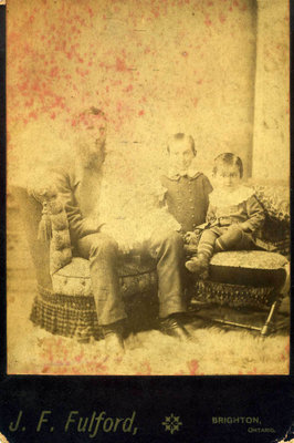 Studio portrait of Edward Mutton, Edward Roy, William Wallace (Wallie), and Garnet Cecil Mutton