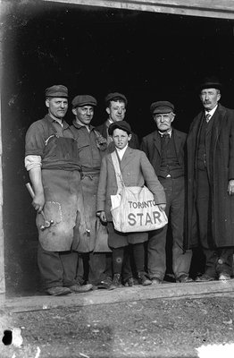 Photograph of Toronto Star paper boy, businessmen and workers, Cramahe Township