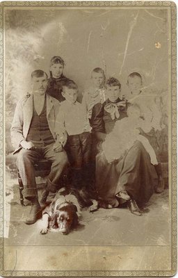 Studio portrait of a family with dog, Castleton, ca.1890