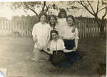 Backyard group portrait of women and a young girl