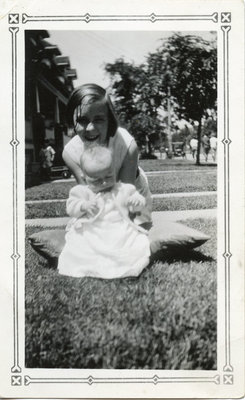 Photograph of a young girl and a baby