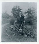 Postcard of a young man with motorized bicycle