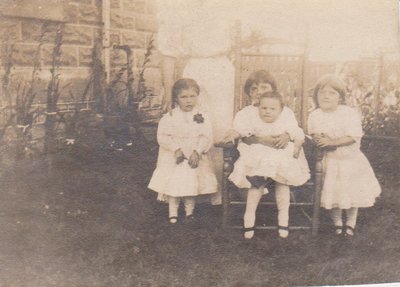 Three girls with a baby