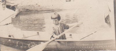 Young man and child in a canoe