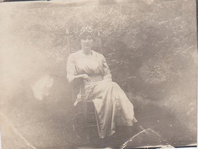 Young woman seated in a chair