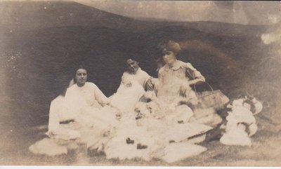 Three women sitting outside