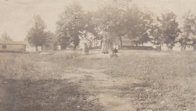 Group of people and a dog on a property