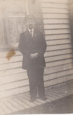 Man in front of a house