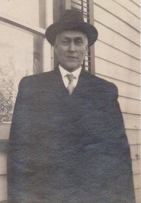 Man in front of a house