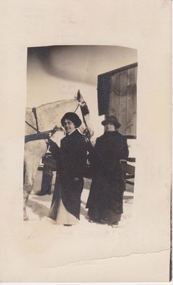 Postcard of two women standing by a dapple-grey carriage horse