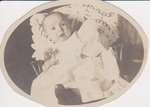 Postcard of baby in a chair