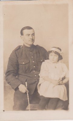 Postcard of father and daughter, studio portrait