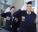 WWII Veteran Don Prentice, left, and former RCAF pilot Dick Newman, right, took the salute from the steps of the Colborne Post Office, Remembrance Day parade, Victoria Square Park, November 11, 2014