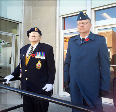 WWII vet Don Prentice, left, and Lt.-Col. Scott Mutton took the salute as the Remembrance Day parade marched after the Cenotaph service in Victoria Square Park in Colborne Nov. 11, 2016.