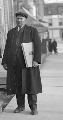 Exhibit, Chief Jamieson holding 1914 portfolio