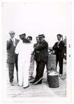 Photograph of men standing on a wharf, possibly Lakeport, Colborne Women's Institute Scrapbook