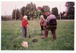 Photograph of Jessie and Roy Hay with Amy Gresham planting a tree in honour of Ellen MacGregor, 1993, Colborne Women's Institute Scrapbook