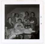 Photograph of Marjorie Rutherford, Goldie Cox, Maggie Mackie, Maizie Cockburn, Amy Gresham, Flossie Pebbles, Hattie McLaughlin and Ellen MacGregor, Colborne Women's Institute Scrapbook