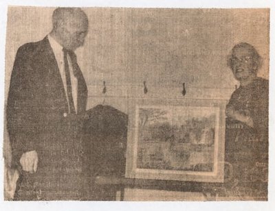 Newspaper photograph of Mrs. Earl Thompson and George Moore, Colborne Women's Institute Scrapbook