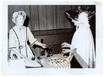 Photograph of Amy Gresham and Ellen MacGregor at Tweedsmuir tea fundraiser, Colborne Women's Institute Scrapbook