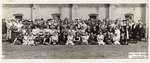 Photograph of Mrs. Ian Heales, Mrs. Arthur Macneilly, Mrs. McCubbin, Mrs. Black, Mrs. Warner, Mrs. Maude Kirk, Mrs. Alex Mackie, Miss Margaret Mackie, Mrs. Ed Barry, Mrs. H. McLaughlin, Mrs. T.M. Gresham, Mrs. W.A. Goodfellow, Mrs. W.A. Moore, Mrs. Gordon MacGregor,  East Northumberland District - Golden Anniversary, 1901-1951, Colborne Women's Institute Scrapbook
