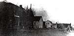 Photograph of G.B. Tait store, Town Hall, Free Methodist Church, blacksmith shop and Pomroy house, Castleton, Castleton Women's Institute scrapbook