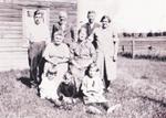 Group photograph of Robert, John, Bill, and Jane Trenear, Adeline Skelton, Victoria Peters, Em, Art, and Jen Trenear, Cramahe Township